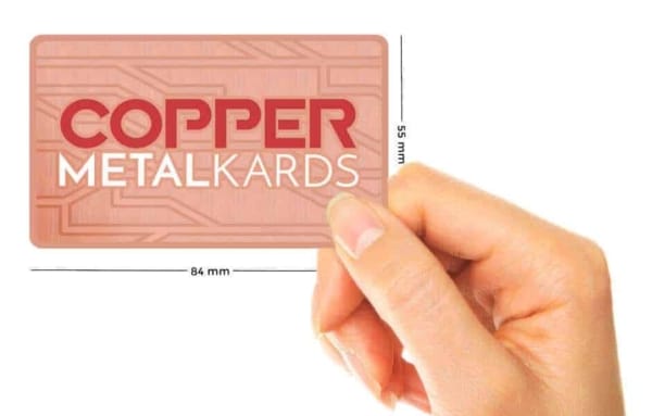 Holding Copper Metal Cards